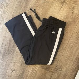 Nike. Classic Black Track Pants, White Tuxedo Stripes. Fully Lined. Size M.